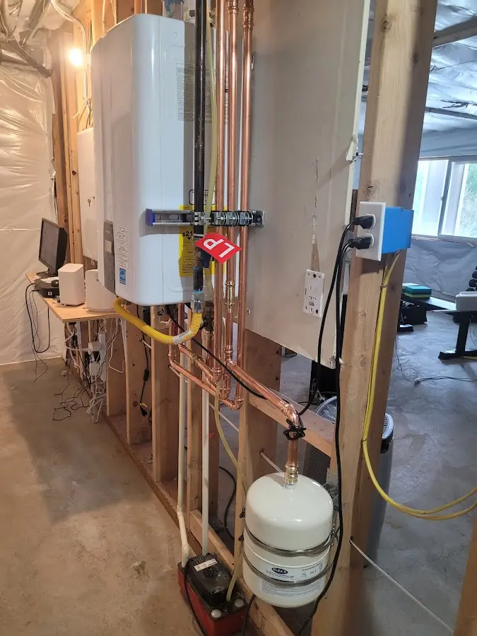 Licensed plumber repairing a kitchen sink in Mora