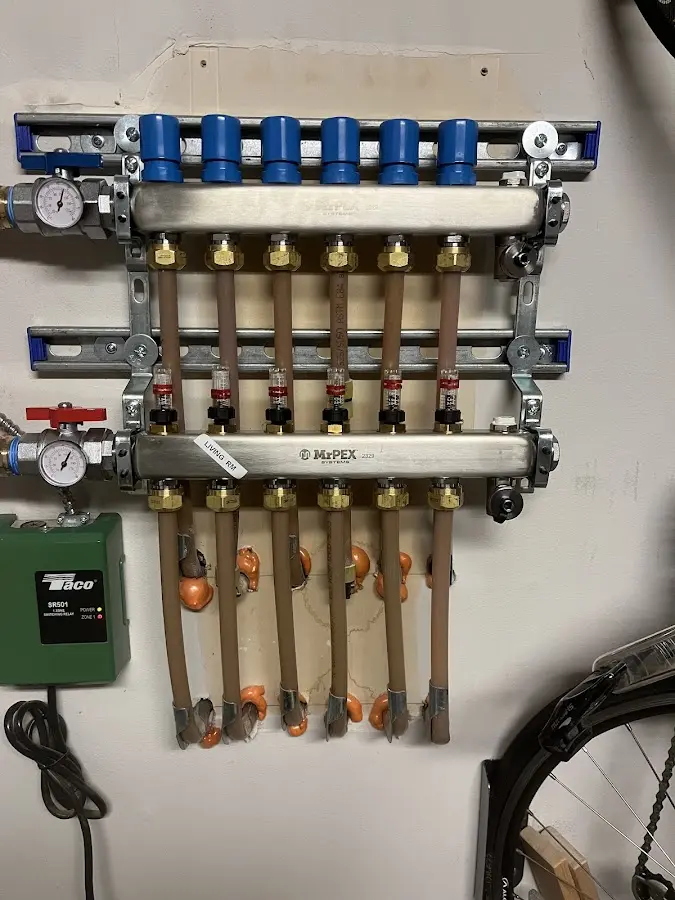 Plumber performing Water Heater Repair at a residential property in Mora